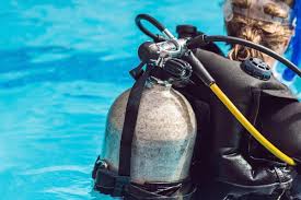 Why do divers carry oxygen cylinders